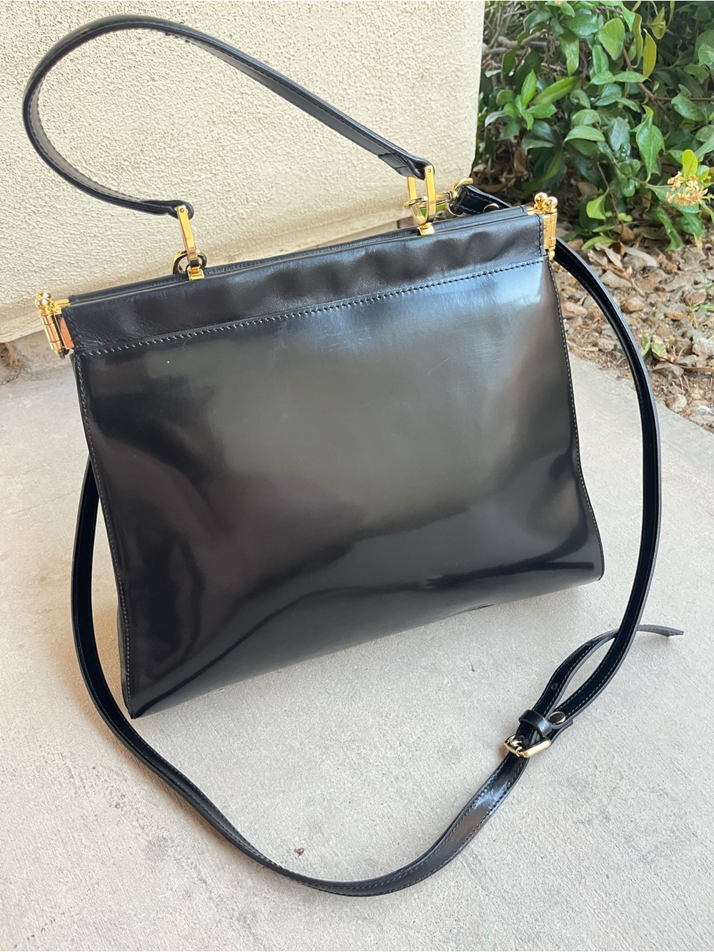 A. Bellucci black leather handbag